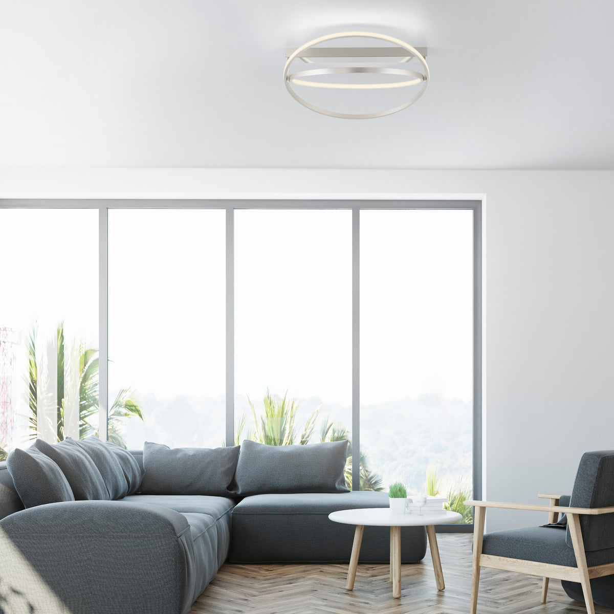 Mise en ambiance dans un salon contemporain, plafonnier allumé au plafond.