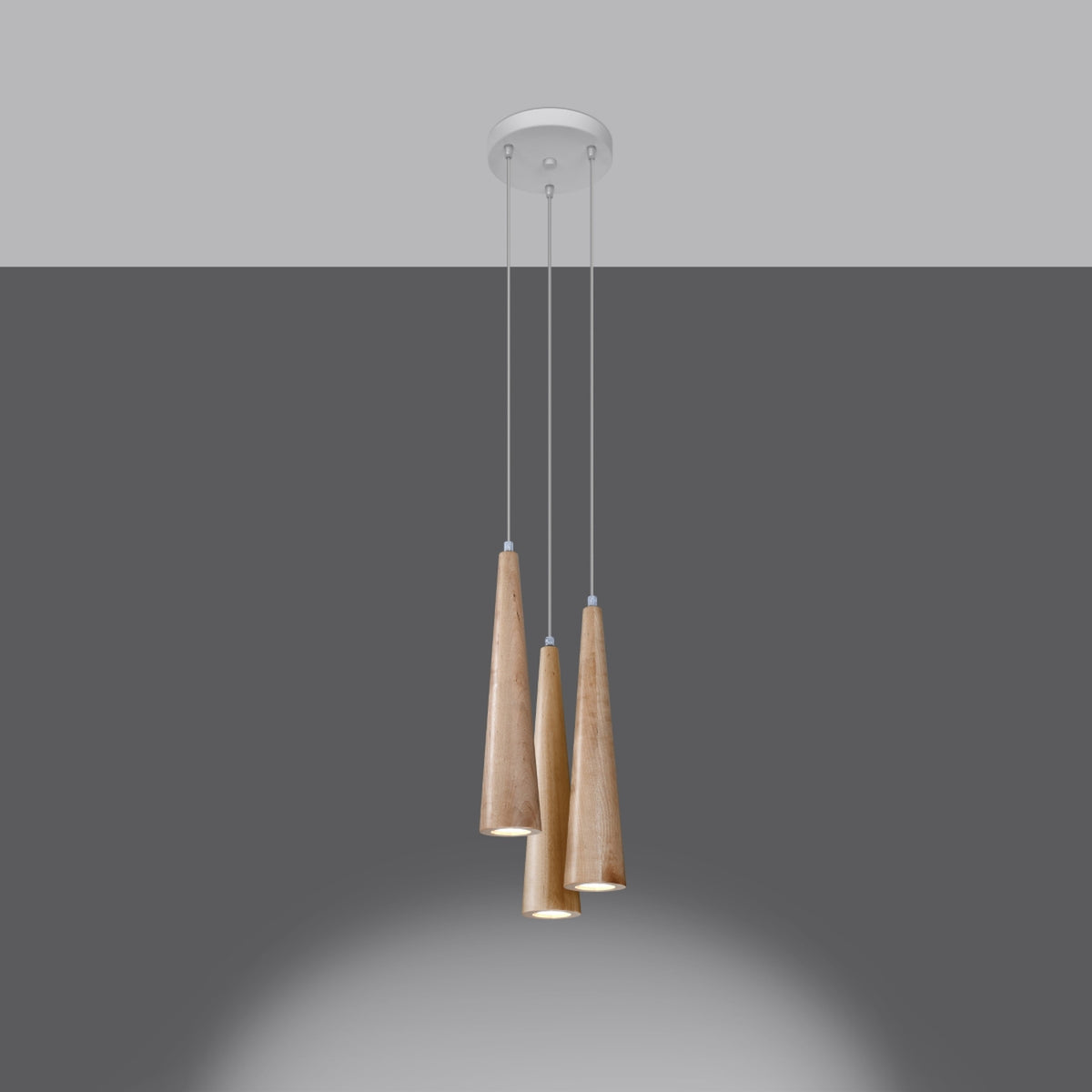 Luminaires allumés sur fond gris foncé, halo lumineux diffus vers le bas
