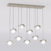 Suspension Ritual 9 lumières beige, verre blanc