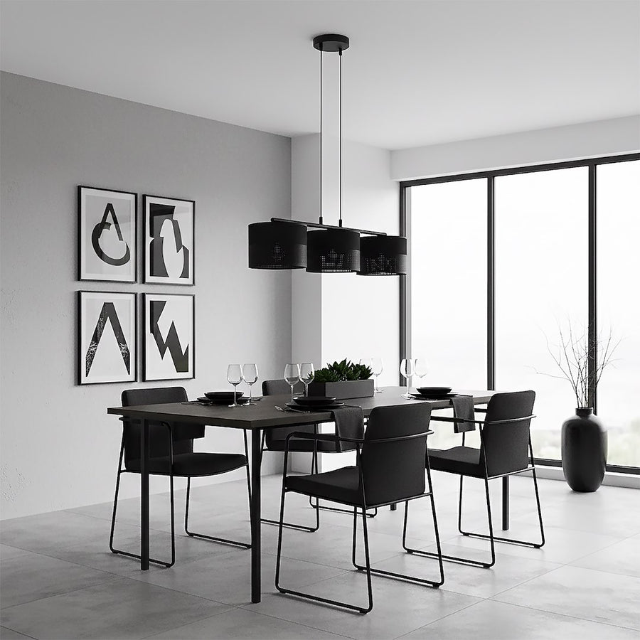 Salle à manger minimaliste noire et blanche, trois cylindres suspendus au-dessus de la table