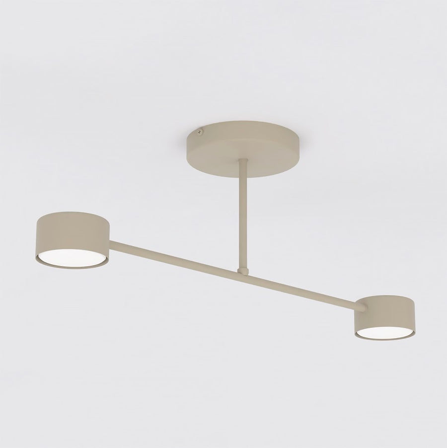 Autre angle du luminaire beige dévoilant le dessous des diffuseurs allumés