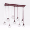 Suspension Cosmo 9 lumières bordeaux, verre transparent