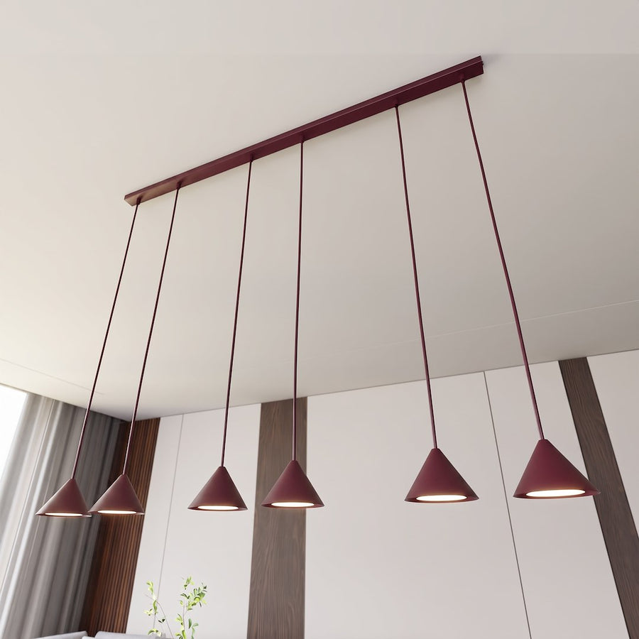 Vue en contre-plongée montrant la longue barre bordeaux fixée au plafond blanc