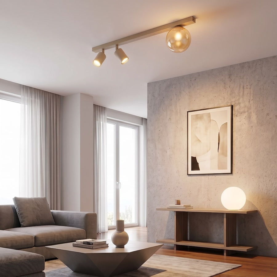 Plafonnier beige installé au plafond dans un salon moderne avec mur béton et canapé.