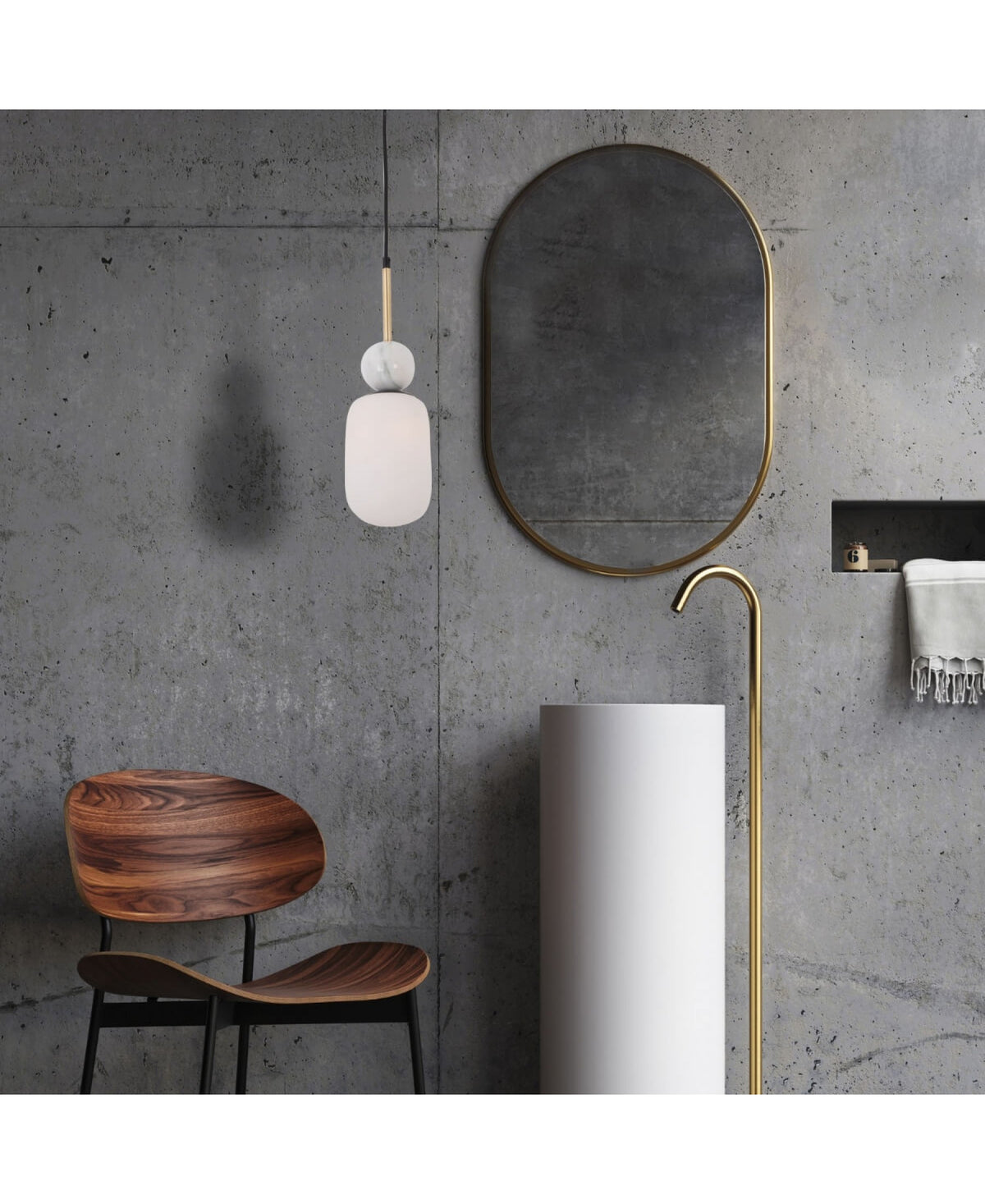 Vue rapprochée de la suspension devant un miroir ovale et un mur béton