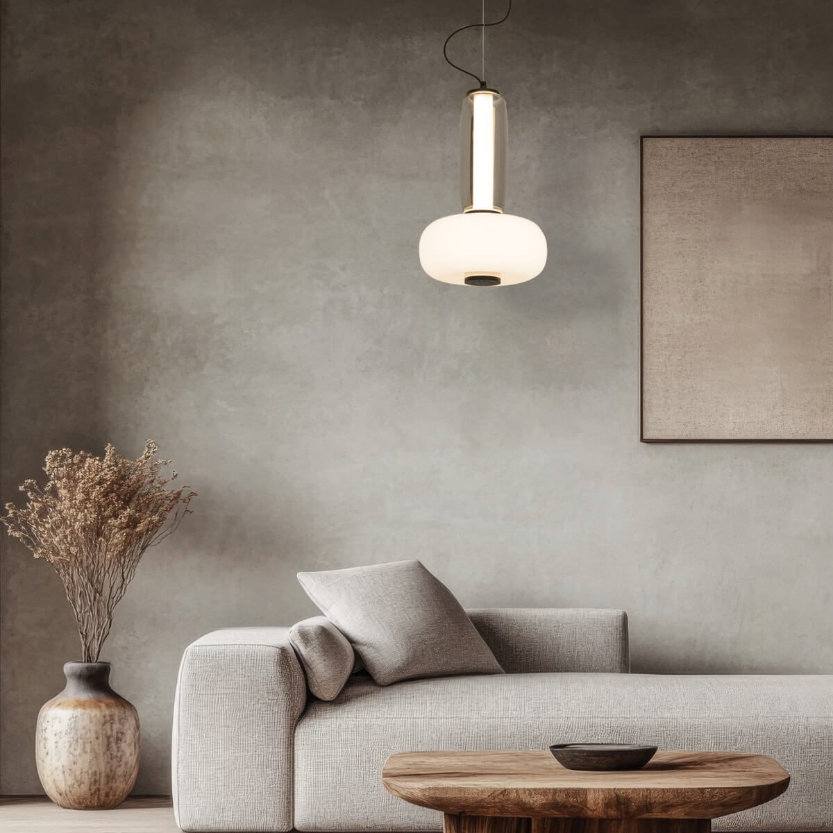 Détail du bas du luminaire, pastille noire sous le diffuseur lumineux