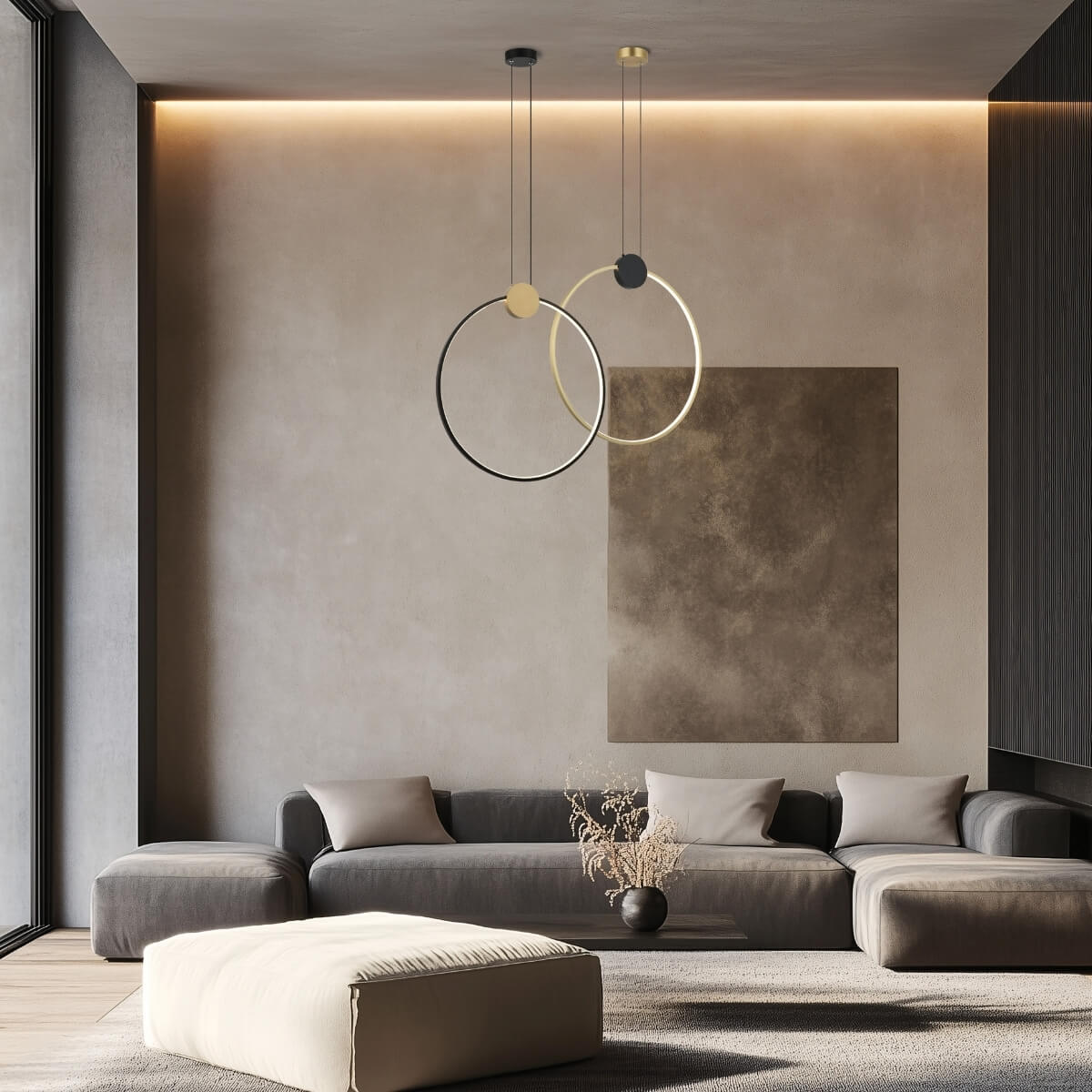 Ambiance de salon moderne avec deux suspensions circulaires noire et dorée au plafond.