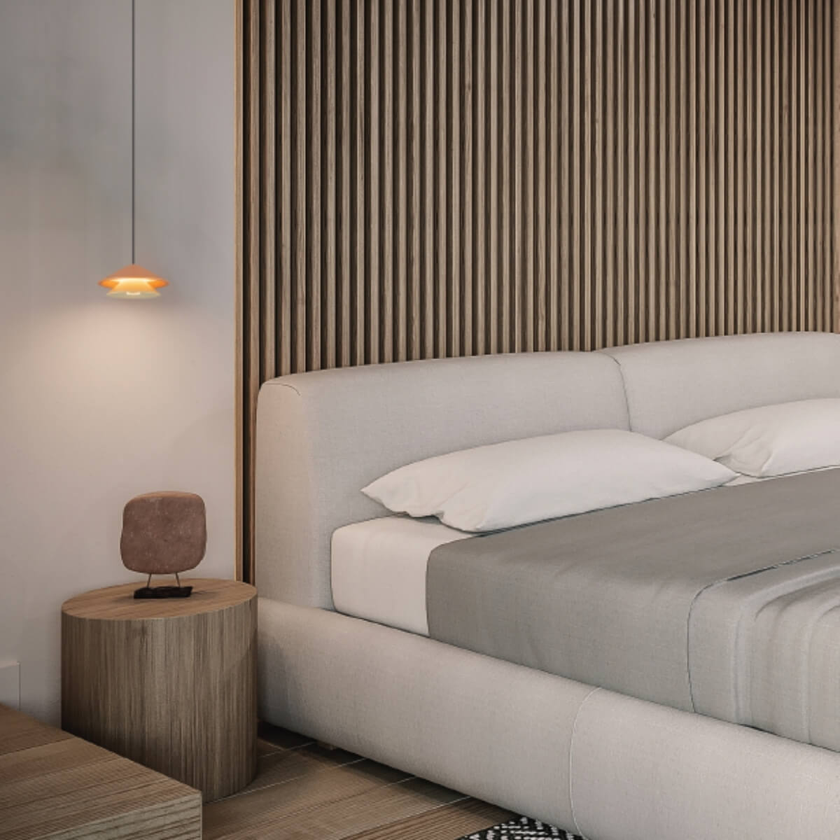 Mise en ambiance chambre, cadrage serré sur la suspension et le lit