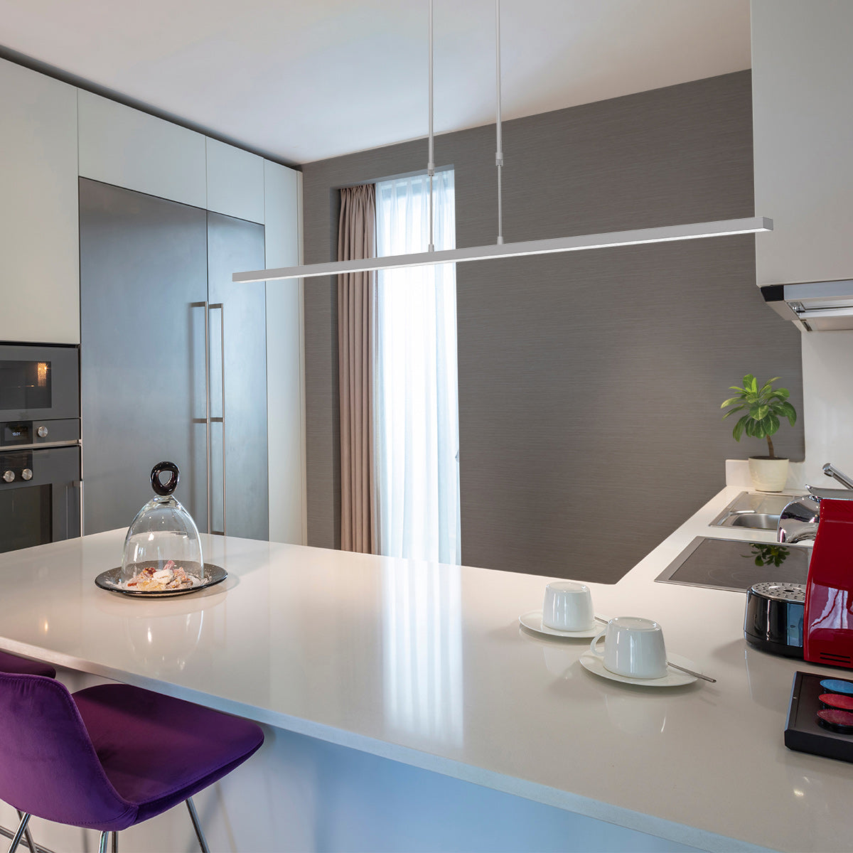 Lustre barre led au-dessus d'un îlot de cuisine moderne