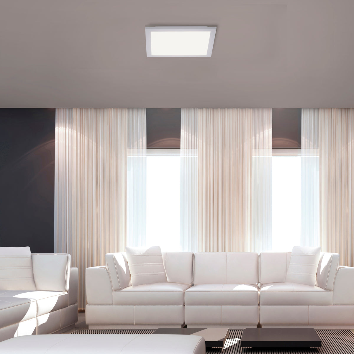 Mise en ambiance d'un salon moderne avec le plafonnier allumé au plafond