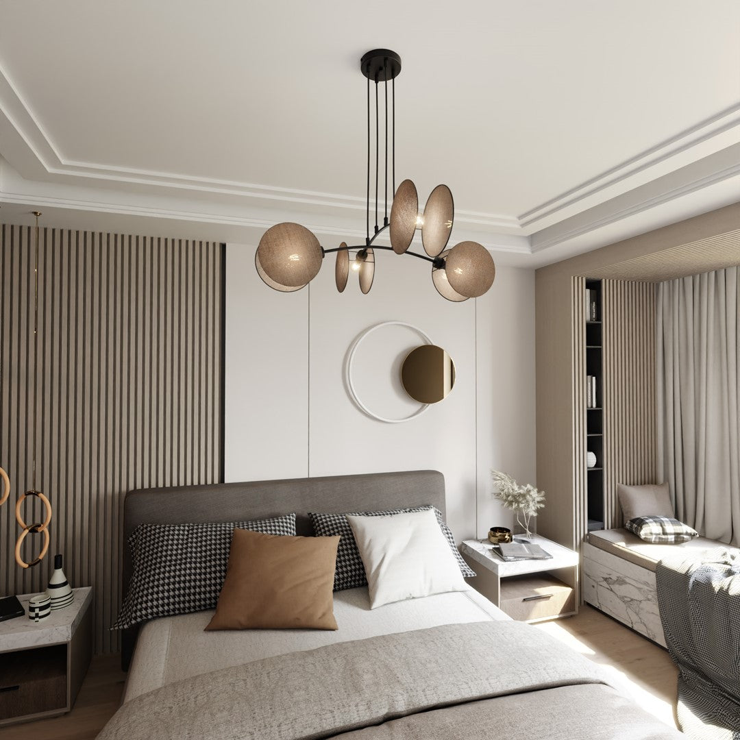 Mise en ambiance du luminaire suspendu au-dessus d'un lit dans une chambre.