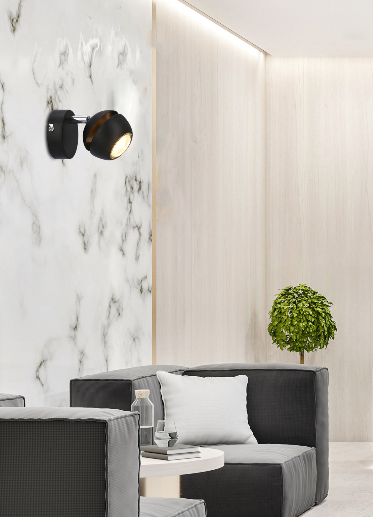 Mise en ambiance salon contemporain, applique noire allumée au-dessus d'un canapé gris