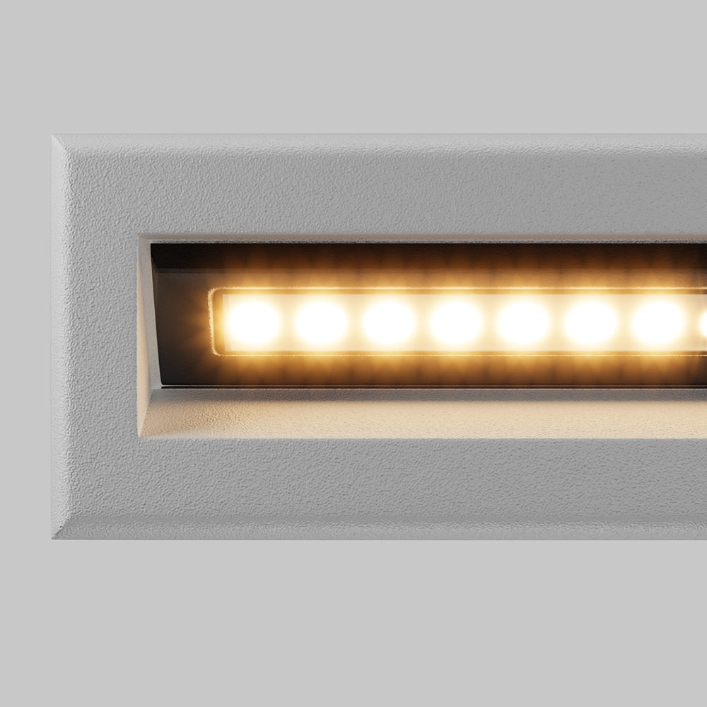 Détail de la finition blanche granulée et de la rangée de LED allumées