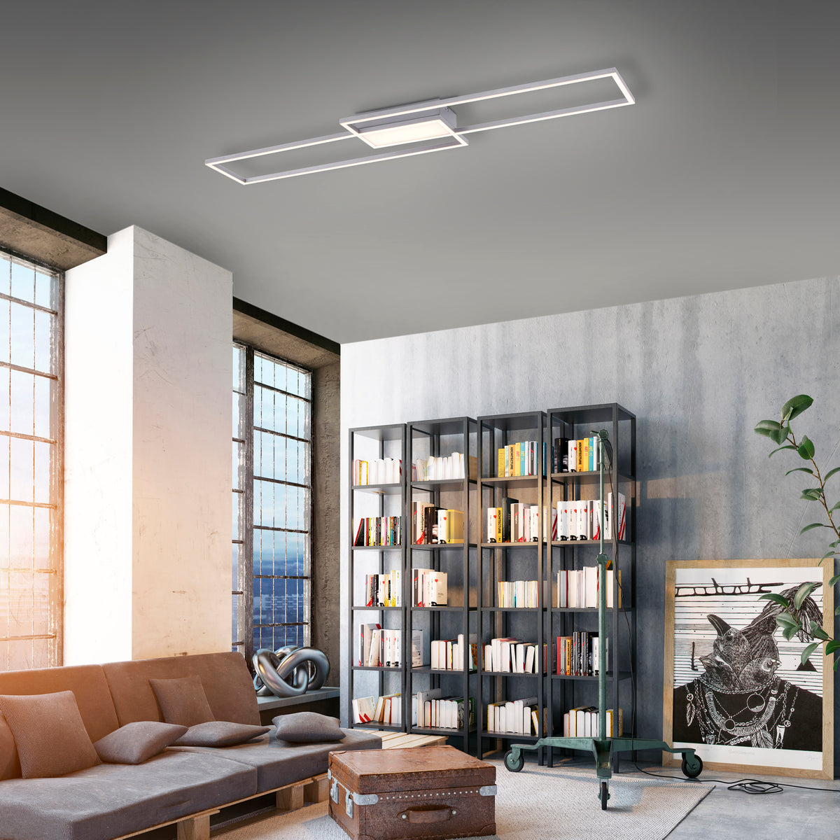 Mise en ambiance du luminaire allumé au plafond d'un salon contemporain avec bibliothèque
