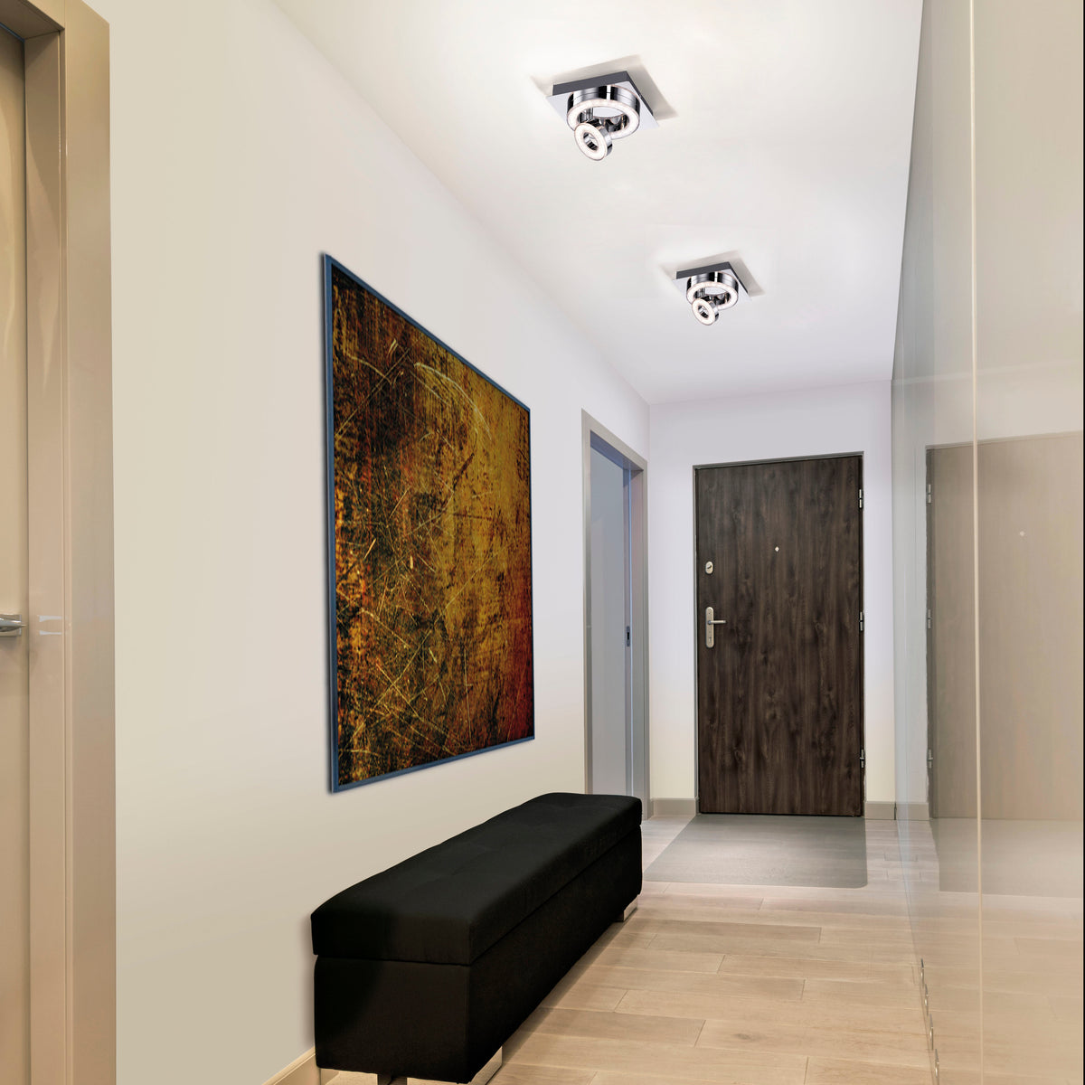 Mise en ambiance de deux plafonniers chromés dans un couloir moderne avec banc noir