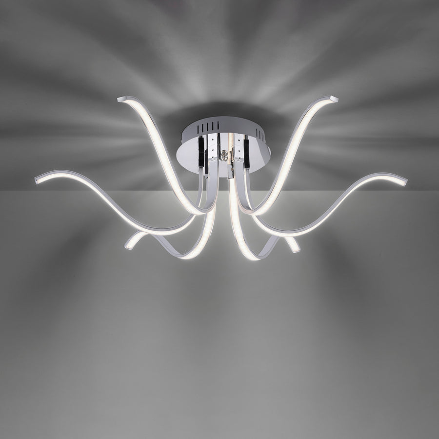 Luminaire allumé vu de dessous, diffusion lumineuse en étoile sur le plafond.