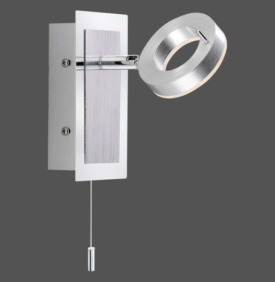 Applique murale chromée avec bras orientable, réflecteur annulaire et interrupteur à tirette.