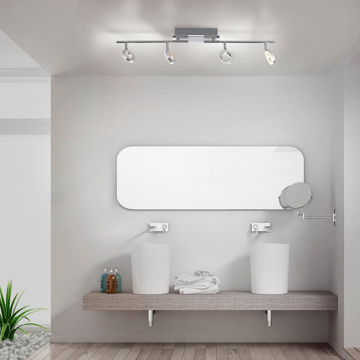 Mise en ambiance salle de bain au-dessus d'un miroir et de vasques doubles.