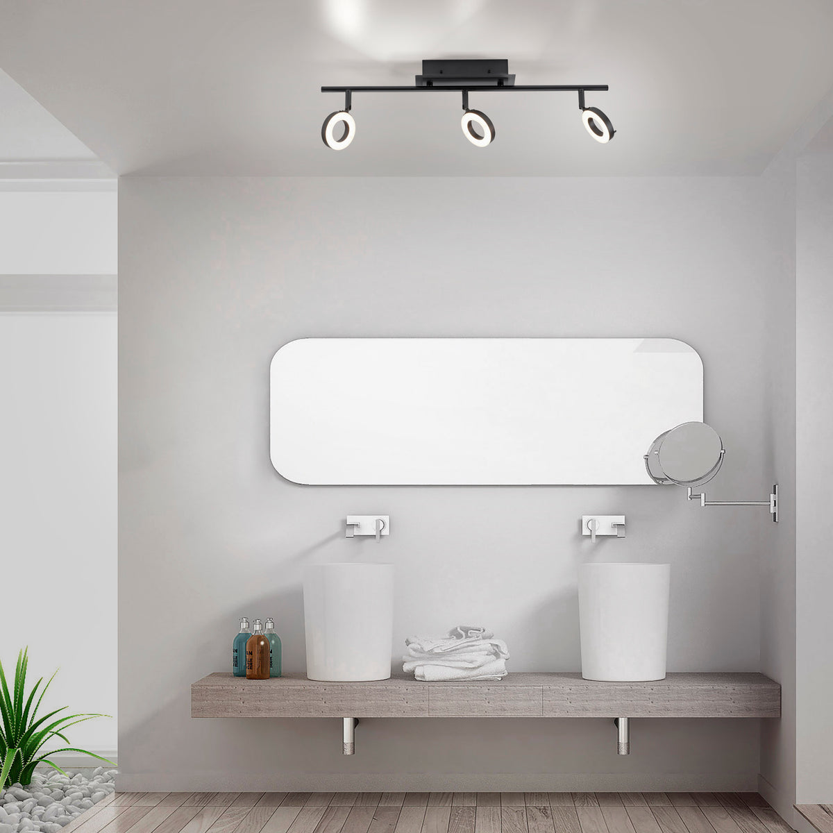 Mise en ambiance dans une salle de bain moderne au-dessus d'un miroir et double vasque