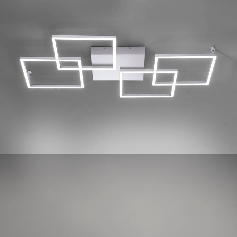 Détail de l'éclairage LED allumé, montrant le cadre rectangulaire lumineux fixé au plafond gris.