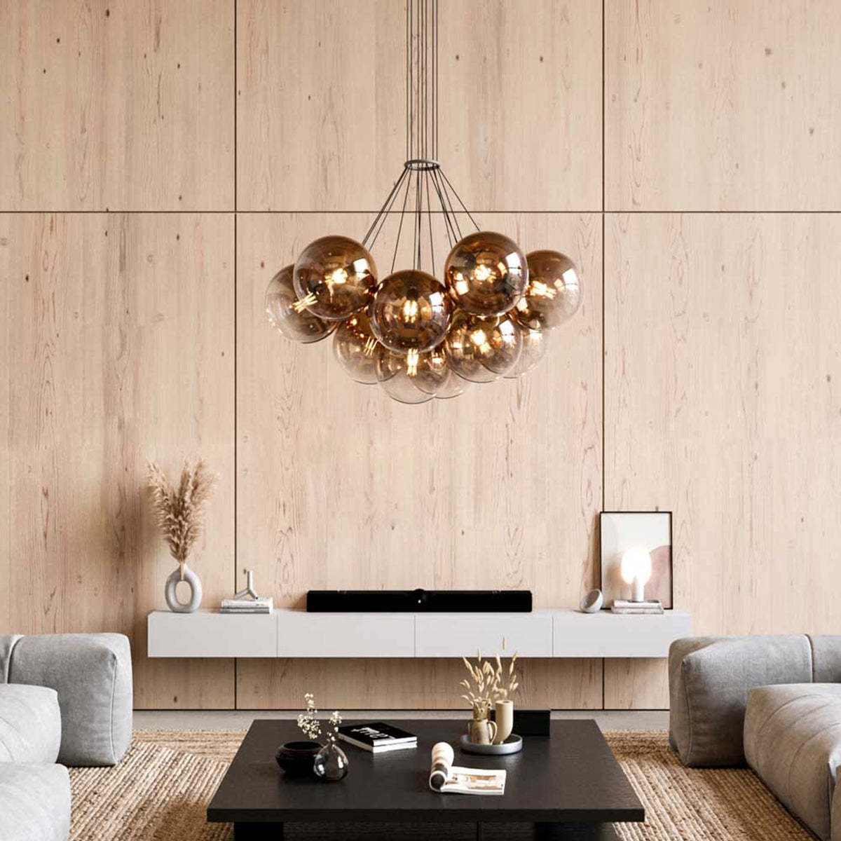 Vue en situation dans un intérieur moderne, la suspension au-dessus d'un meuble bas en bois