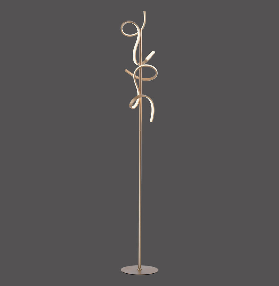 Lampadaire laiton mat aux volutes spiralées, vue de face sur fond gris anthracite