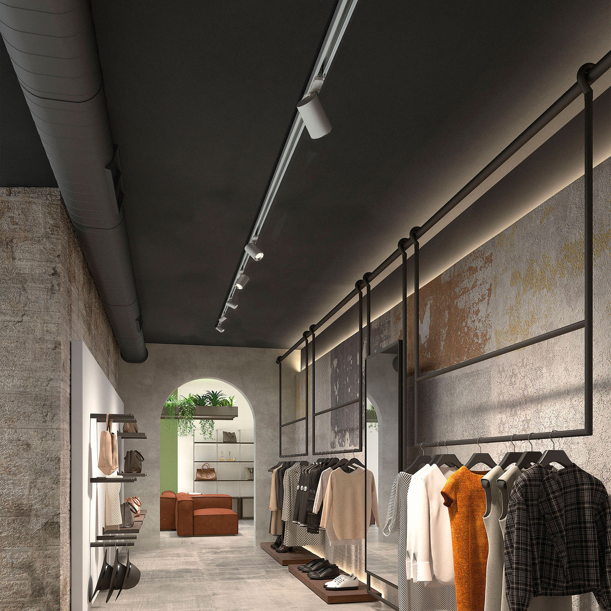 Mise en ambiance dans une boutique de vêtements avec rail au plafond.