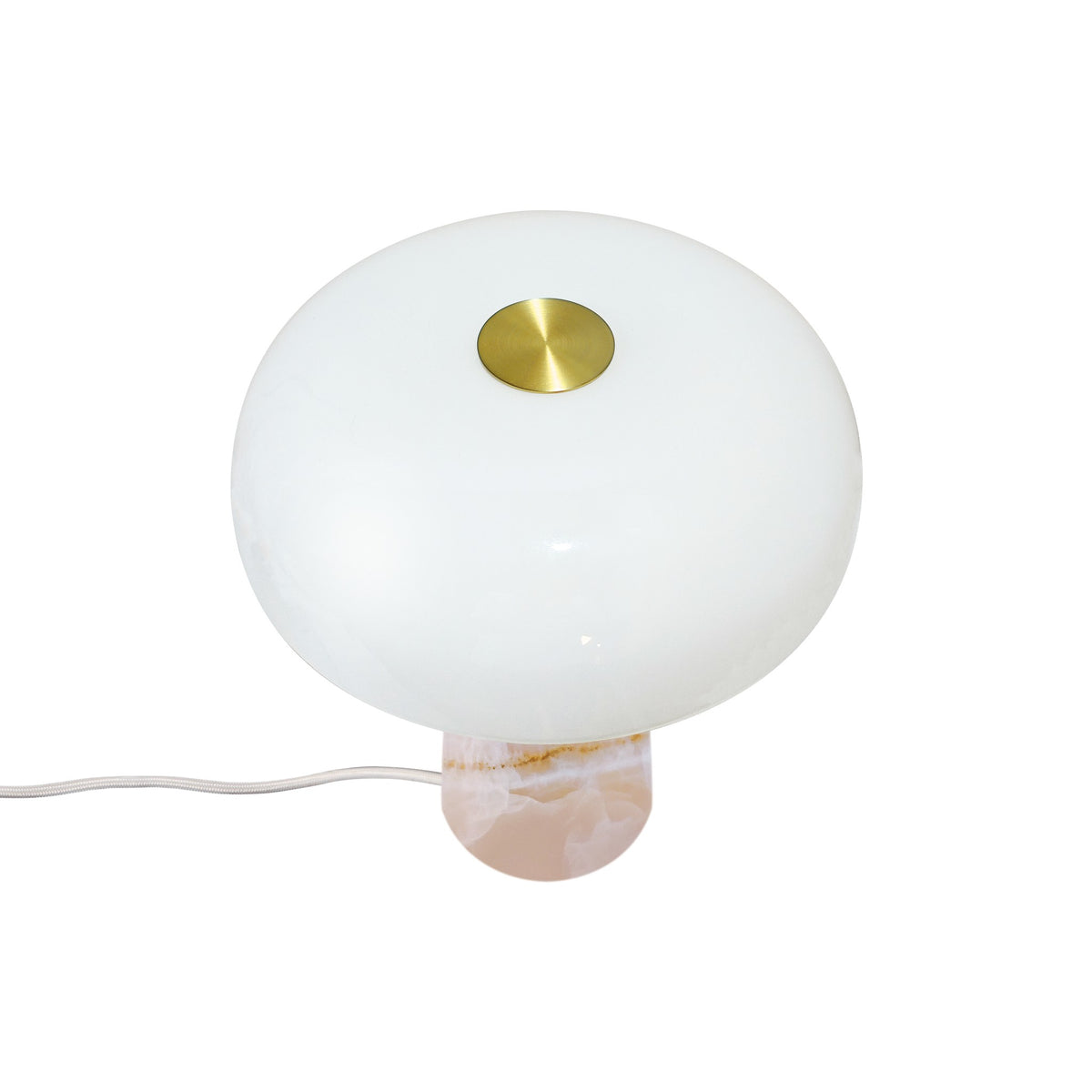 Vue de dessus de la lampe, abat-jour blanc et bouton doré central.