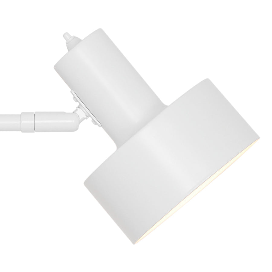 Détail de l'articulation et de l'abat-jour cylindrique blanc, orientable, éteint
