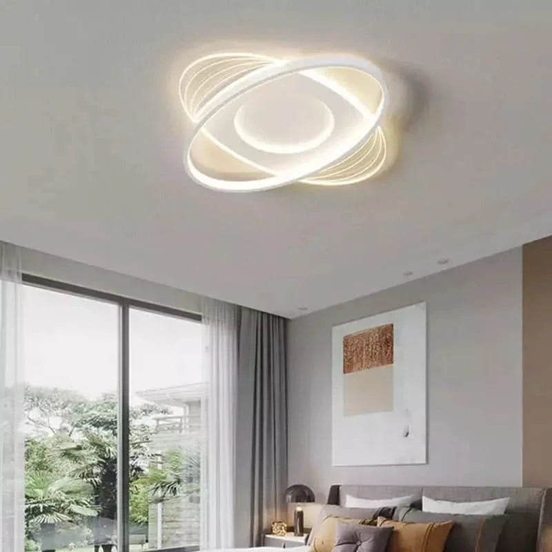 Modèle rond aux cercles entrelacés en ambiance chambre avec baie vitrée
