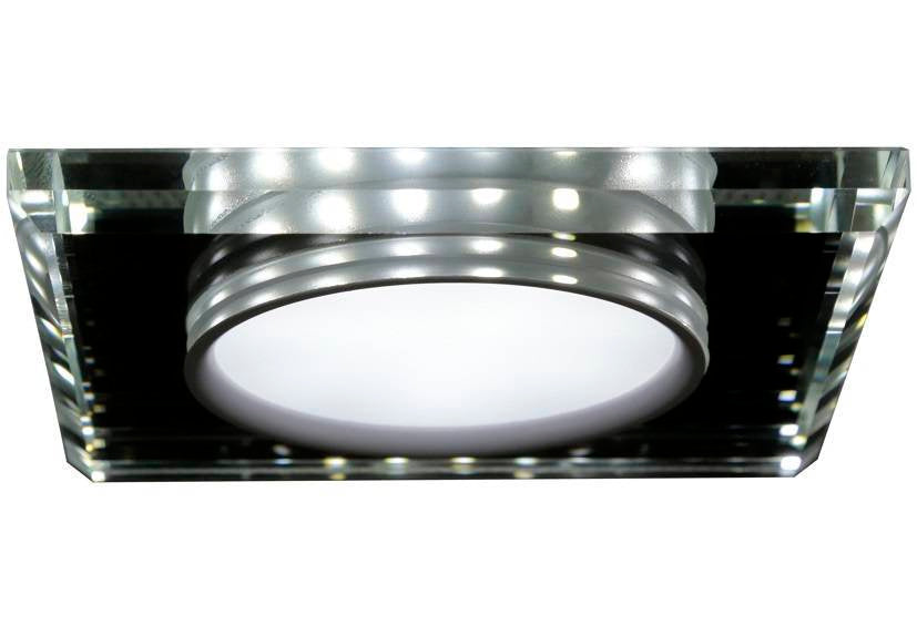 Détail de la couronne LED périphérique et du verre biseauté carré en gros plan.