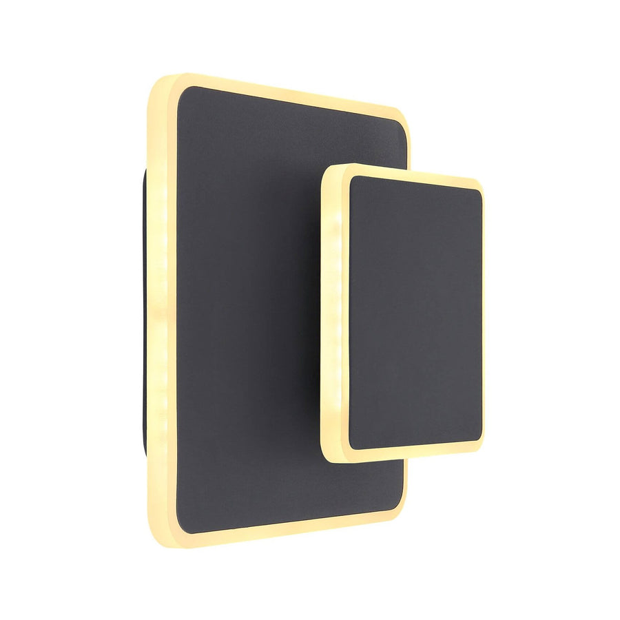 Applique murale noire rectangulaire avec liseré doré, vue de trois quarts sur fond blanc.