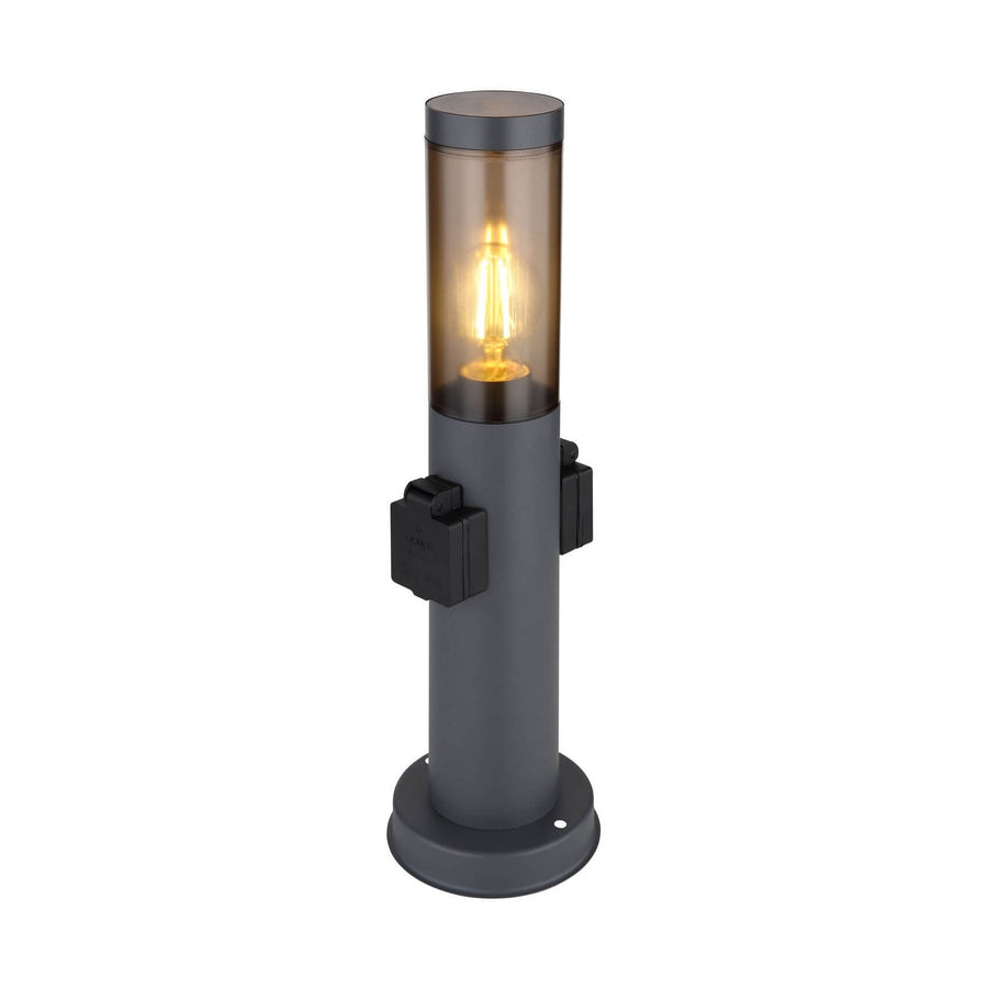 Luminaire extérieur cylindrique anthracite avec ampoule visible et prises latérales sur fond blanc.
