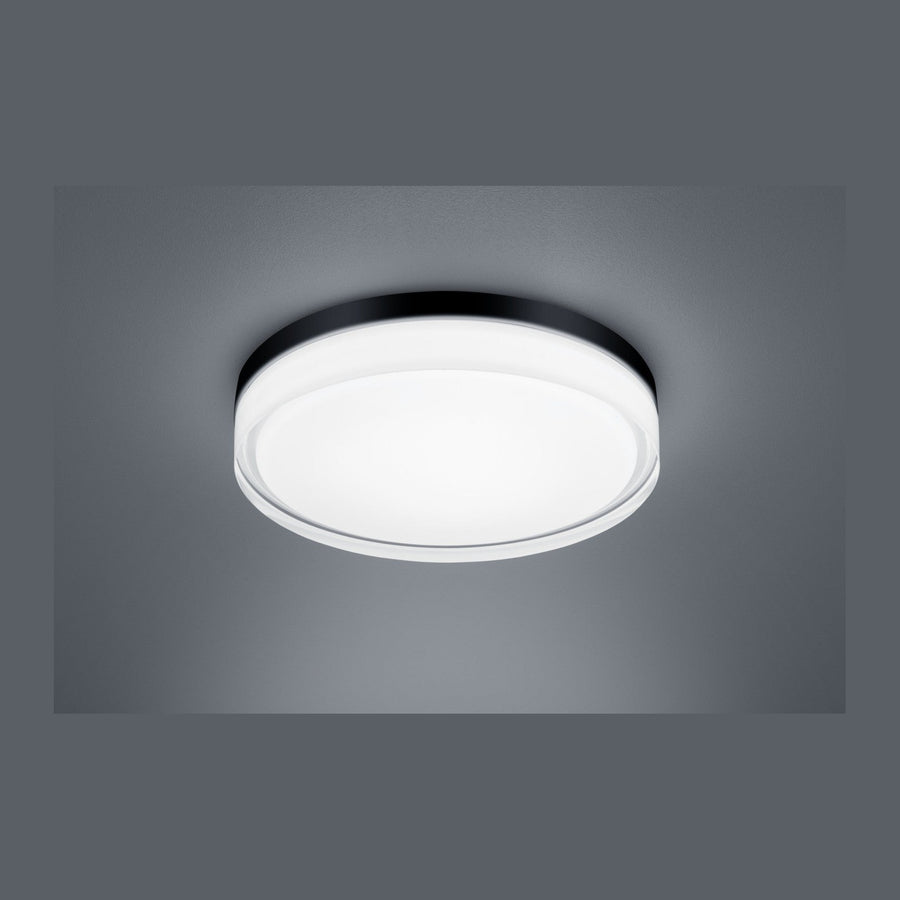 Plafonnier rond vu de face, cerclage noir fin et diffuseur blanc opalin allumé