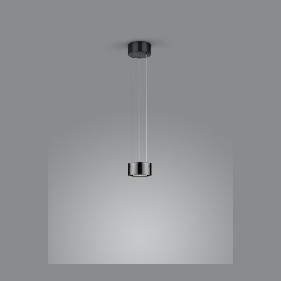 Suspension cylindrique noire et chromée vue de face sur fond gris neutre