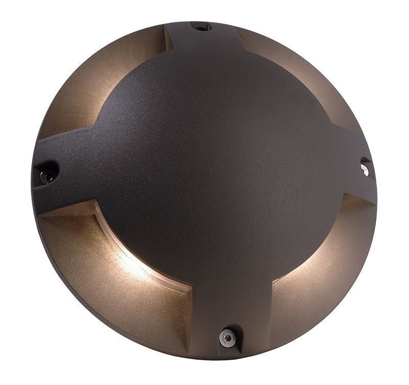 Vue du dessus du luminaire rond, avec les quatre vis apparentes et les fentes lumineuses.