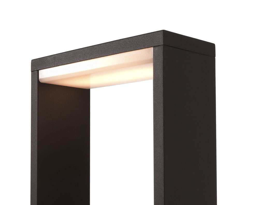 Détail du sommet : diffuseur lumineux intégré et finition anthracite texturée.