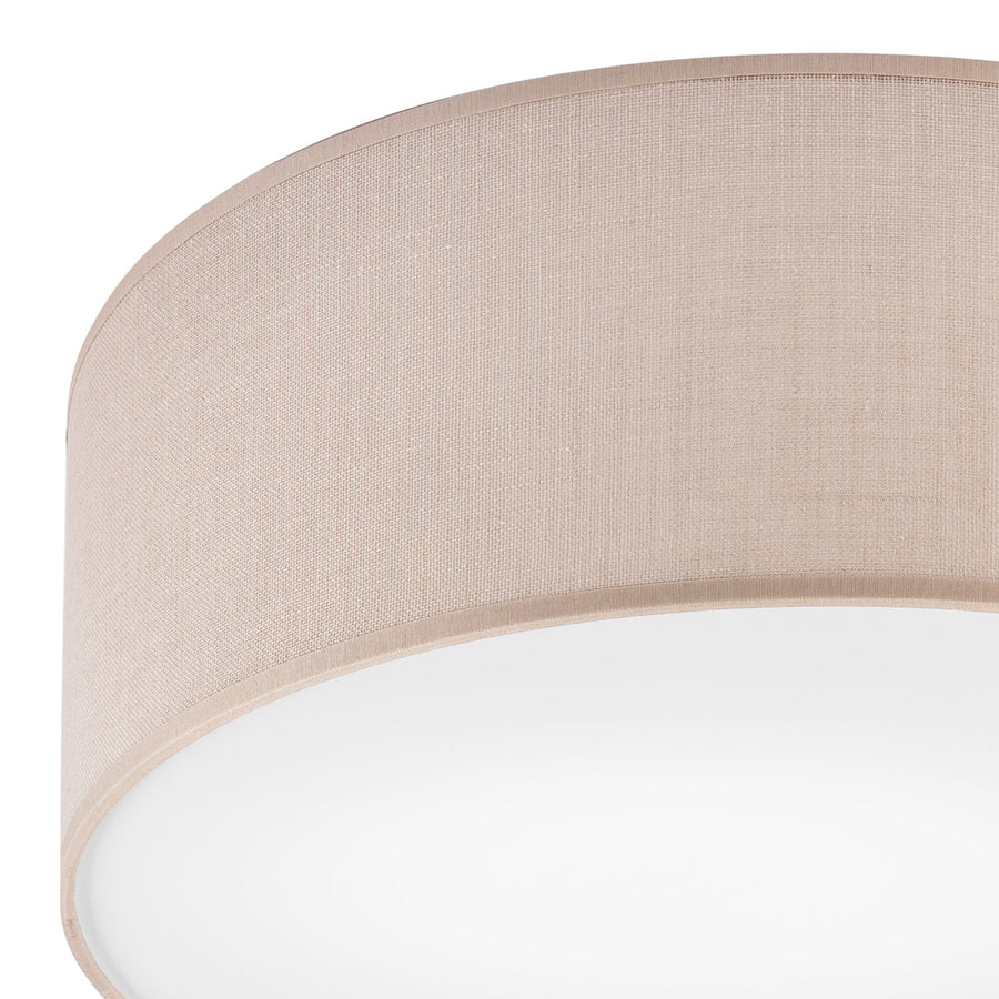 Détail rapproché du bord et de la diffusion blanche du plafonnier beige