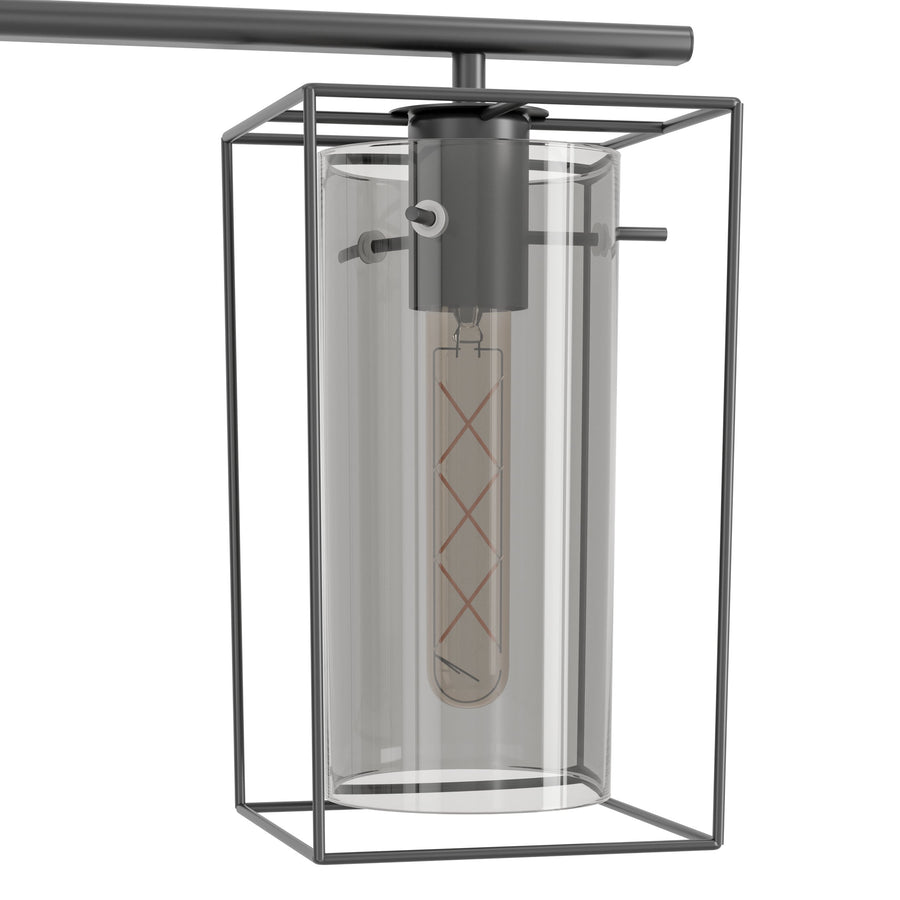 Gros plan sur une cage métallique noire et son verre cylindrique, ampoule à filament visible.