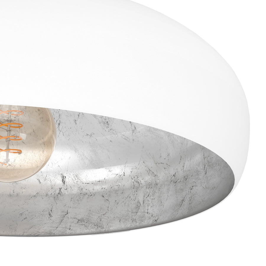Détail rapproché du verre intérieur argenté marbré et de l'ampoule vissée