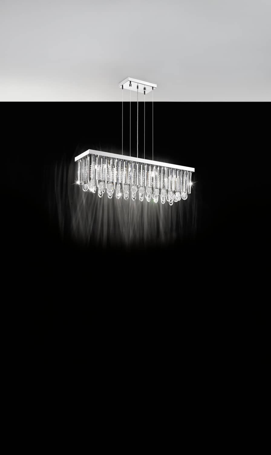Vue en situation dans une pièce sombre, suspension allumée diffusant une lumière scintillante