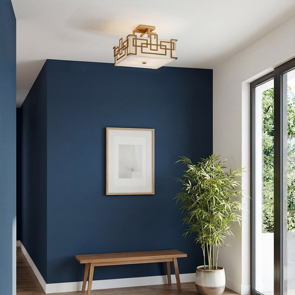 Mise en ambiance dans une entrée au mur bleu nuit
