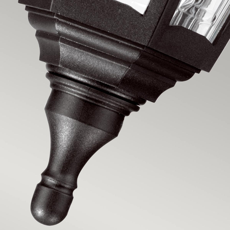 Détail de la pointe inférieure moulurée finissant par un bouton arrondi