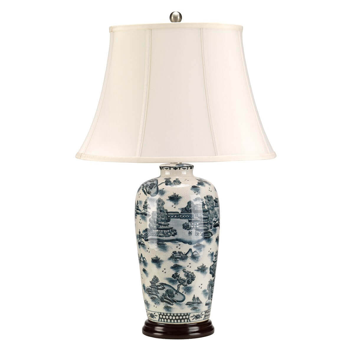 Même lampe vue de face, mettant en valeur l'abat-jour blanc et la base décorée.