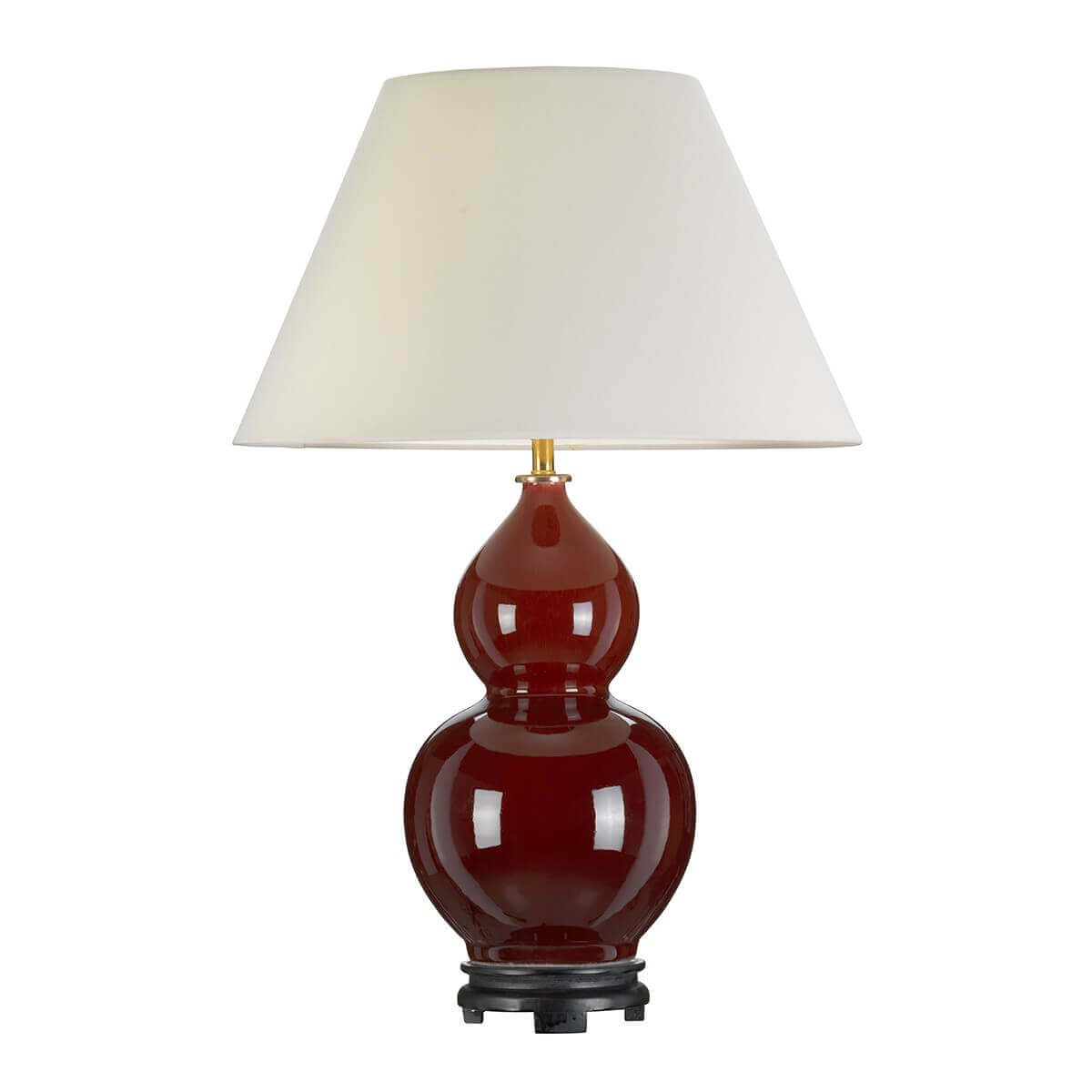 Vue rapprochée du socle noir et du pied vernissé rouge de la lampe