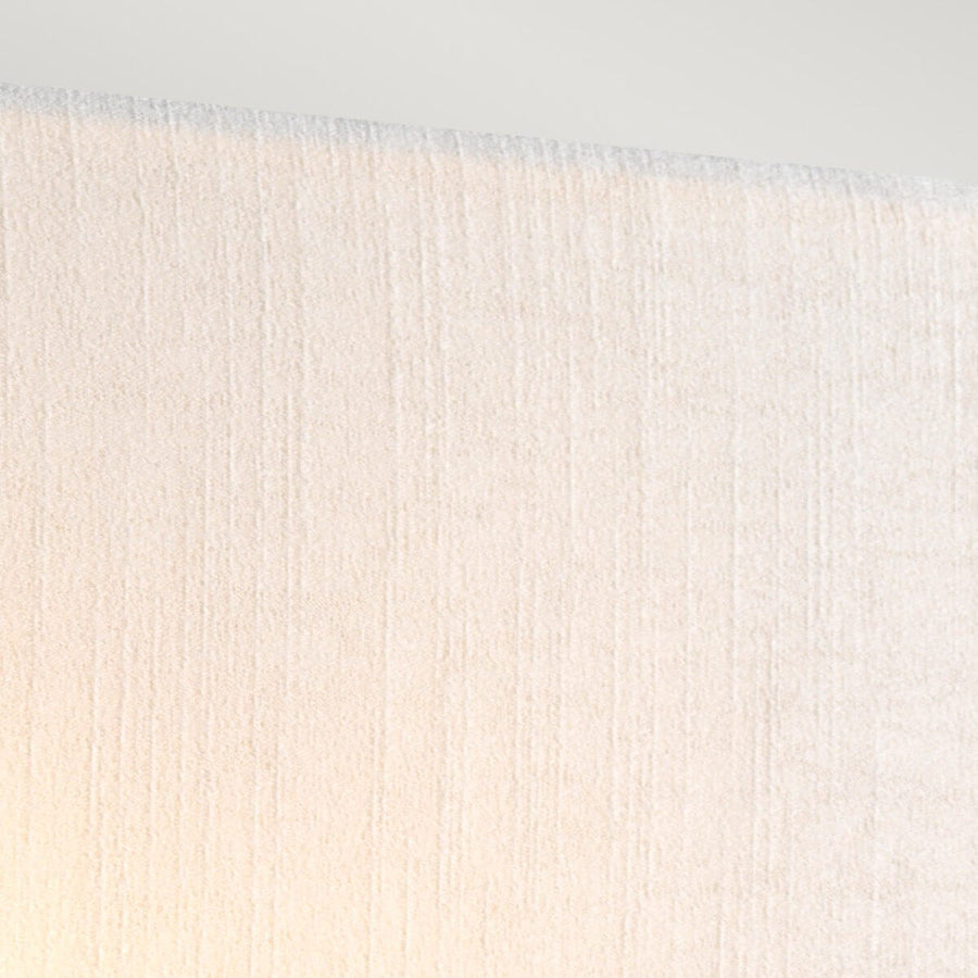 Détail de la bordure supérieure et de la texture tissée de l'abat-jour crème
