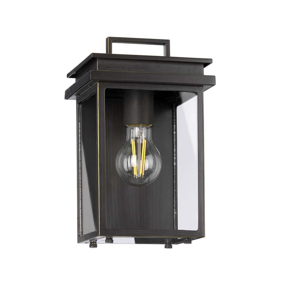 Luminaire allumé de face, ampoule à filament visible dans le verre clair