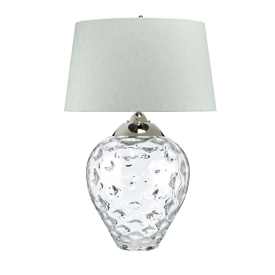 Détail du verre martelé transparent formant une panse arrondie au-dessus de la base
