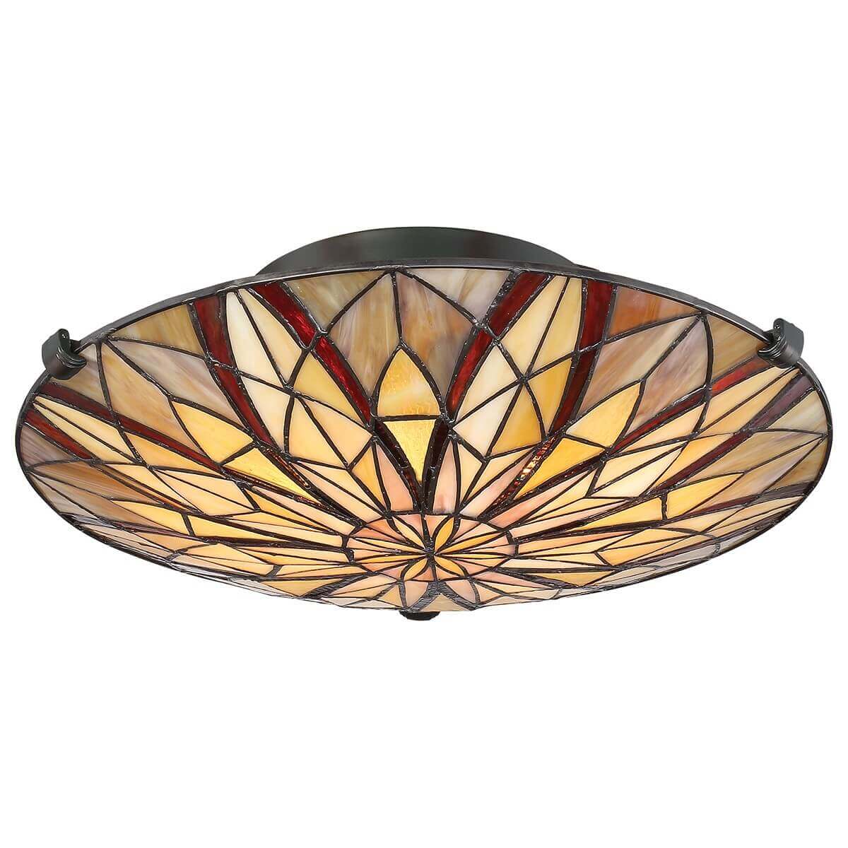 Luminaire allumé de face, mettant en valeur les reflets chauds du verre