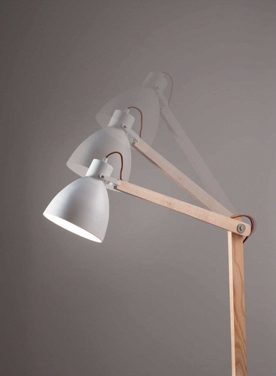 Schéma montrant les trois positions d'inclinaison du bras articulé de la lampe
